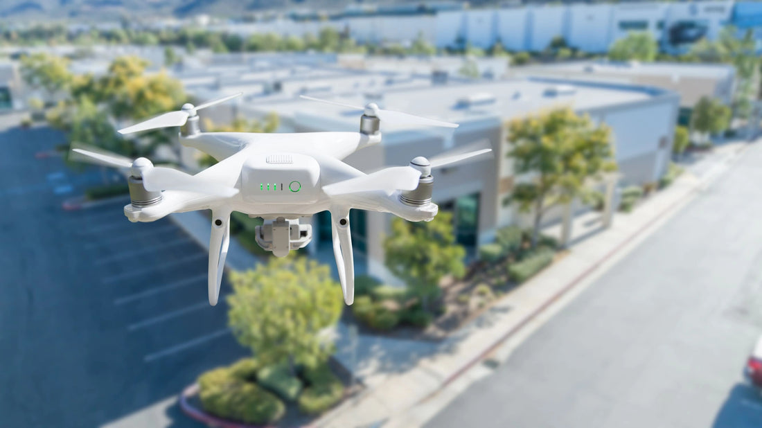 Innovations in land surveying equipment represented by a white drone flying above a city