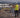 A surveyor standing on a work site with tripod and a letters asking whether RTK Service or Local Base Station is better. 