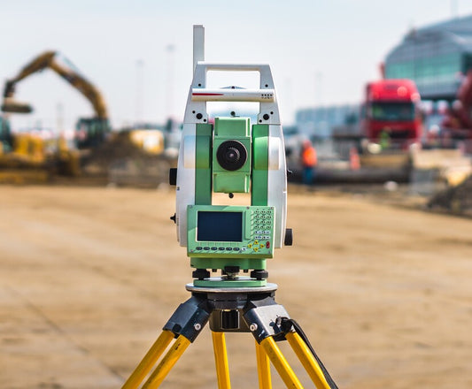 Leica total station mounted on a tripod for accurate land surveying